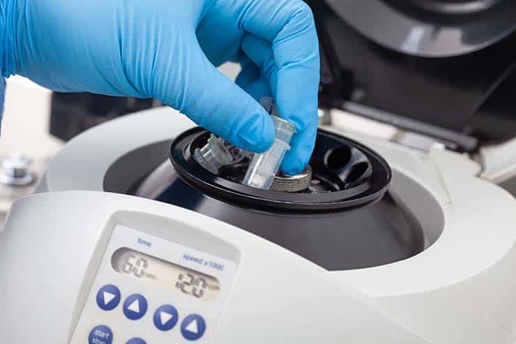 scientist hand centrifuge for RNA purification